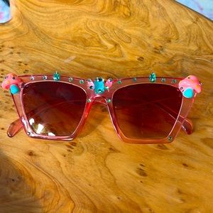 Pink sunglasses with mushrooms and green rhinestones gemstones